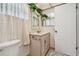 Neutral bathroom with a vanity and mirrored medicine cabinet at 1265 Royal Oak Dr, Dunedin, FL 34698