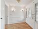 Bright entryway featuring hardwood floors, decorative molding, and a stylish front door at 1265 Royal Oak Dr, Dunedin, FL 34698