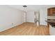 Bright living room with wood floors that flows into the kitchen at 1265 Royal Oak Dr, Dunedin, FL 34698