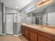 Bathroom boasts double sinks, large vanity, and a glass-enclosed shower at 13049 Moonstone Way, Spring Hill, FL 34609