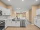 Open kitchen overlooking the living area features stainless steel appliances and a large sink at 13049 Moonstone Way, Spring Hill, FL 34609