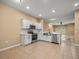 Bright open kitchen with modern appliances and view of living area at 13049 Moonstone Way, Spring Hill, FL 34609