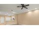 Bright living area features wood-look floors and a ceiling fan at 13049 Moonstone Way, Spring Hill, FL 34609