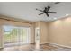 Open living area features wood-look floors, recessed lighting, and ceiling fan at 13049 Moonstone Way, Spring Hill, FL 34609