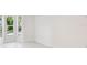 Bright bedroom featuring bay windows, hardwood floors, and neutral accents at 13901 Vacation Ln, Odessa, FL 33556