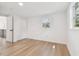 Bright bedroom featuring hardwood floors and a closet at 13901 Vacation Ln, Odessa, FL 33556