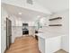 Modern kitchen with white cabinets, stainless steel appliances, and butcher block countertop at 13901 Vacation Ln, Odessa, FL 33556