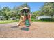 A playground with a slide and climbing structure, set in a safe, mulched environment at 13901 Vacation Ln, Odessa, FL 33556
