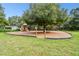 A neighborhood playground offers children a fun and safe place to play, while parents socialize nearby at 13901 Vacation Ln, Odessa, FL 33556