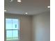 A sun-filled bedroom offers a bright and airy space with a large window at 14425 Maiden Ter, Lakewood Ranch, FL 34211