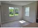 Bright dining area features tile flooring and two windows letting in natural light at 14425 Maiden Ter, Lakewood Ranch, FL 34211