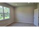 Bright bedroom featuring a window with natural light, neutral walls, and plush carpeting at 14429 Maiden Ter, Lakewood Ranch, FL 34211