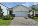 Charming single-Gathering home boasts a two-car garage and brick-paved driveway at 14429 Maiden Ter, Lakewood Ranch, FL 34211