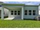 A covered patio off the rear of the house provides the perfect space to enjoy the backyard at 14437 Maiden Ter, Lakewood Ranch, FL 34211