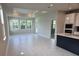 Bright living room open to kitchen with a large window and lots of natural light at 14437 Maiden Ter, Lakewood Ranch, FL 34211