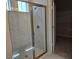 Bathroom walk-in shower with glass door, tile surround, and modern fixtures at 14437 Maiden Ter, Lakewood Ranch, FL 34211