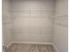 Walk-in closet featuring ample shelving for optimal organization and storage solutions at 14437 Maiden Ter, Lakewood Ranch, FL 34211