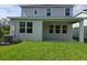 A large backyard with a covered porch, perfect for outdoor relaxation at 14441 Maiden Ter, Lakewood Ranch, FL 34211
