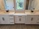 Bathroom showcasing dual vanities with quartz countertops, framed mirrors, and tiled floor at 14441 Maiden Ter, Lakewood Ranch, FL 34211