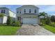 Charming two-story home with a brick-paved driveway and a two-car garage at 14441 Maiden Ter, Lakewood Ranch, FL 34211