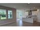 Bright and open concept living space with tiled floors and a modern kitchen at 14441 Maiden Ter, Lakewood Ranch, FL 34211