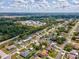 Charming home nestled in a serene neighborhood with lush greenery and well-maintained surrounding properties at 14646 Coronado Dr, Spring Hill, FL 34609