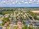 Aerial perspective showcasing a community with tree lined street, homes with mature landscaping, offering a sense of place at 14646 Coronado Dr, Spring Hill, FL 34609