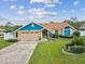 Charming single-Gathering home featuring well-maintained landscaping, a two-car garage, and a welcoming entrance at 14646 Coronado Dr, Spring Hill, FL 34609
