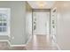 Bright foyer featuring tile flooring, a front door with sidelights, and neutral wall paint at 14646 Coronado Dr, Spring Hill, FL 34609