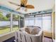 Relaxing sunroom with a hot tub, lots of windows, and a ceiling fan at 14646 Coronado Dr, Spring Hill, FL 34609
