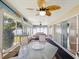 Large sunroom with lots of windows, ceiling fan and sliding glass doors, perfect for entertaining at 14646 Coronado Dr, Spring Hill, FL 34609