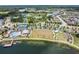 Aerial view highlighting the community amenities, including a pool, tennis courts, park, and lakes at 1783 Oak Hammock Ct, Lutz, FL 33558