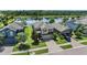 An aerial view of the home reveals a scenic location near a serene lake and well-maintained landscaping at 1783 Oak Hammock Ct, Lutz, FL 33558