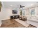 Cozy living room features stylish furnishings, wood-look tile flooring, and a relaxing atmosphere with ample natural light at 1783 Oak Hammock Ct, Lutz, FL 33558