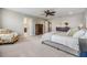 Spacious main bedroom features plush carpeting and ample natural light, creating a relaxing and inviting retreat at 1783 Oak Hammock Ct, Lutz, FL 33558