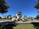 Community playground with climbing structures, slides, and shaded areas for children to enjoy at 1783 Oak Hammock Ct, Lutz, FL 33558