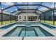 Inviting screened-in pool features ample seating and a tranquil atmosphere for leisure and enjoyment at 1783 Oak Hammock Ct, Lutz, FL 33558