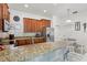 Well-equipped kitchen with granite countertops, stainless steel appliances, and a breakfast bar with seating at 18530 Dobson Dr, Hudson, FL 34667