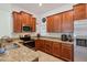 Modern kitchen with ample cabinet space, granite countertops, stainless steel appliances, and tile backsplash at 18530 Dobson Dr, Hudson, FL 34667