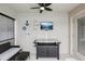 Relaxing patio with TV, ceiling fan, and nautical decor creating an inviting space for enjoying outdoor leisure at 18530 Dobson Dr, Hudson, FL 34667