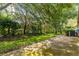 This home has a concrete patio perfect for outdoor seating surrounded by a lush, tree-lined backyard at 18736 Bent Pine Dr, Hudson, FL 34667