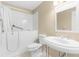 Accessible bathroom features a walk-in tub, white tile, and modern sink at 18736 Bent Pine Dr, Hudson, FL 34667