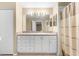 Bathroom with vanity, shower, and ample storage at 18736 Bent Pine Dr, Hudson, FL 34667