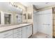 White-tiled bathroom featuring a shower-tub combination with a light neutral shower curtain at 18736 Bent Pine Dr, Hudson, FL 34667