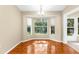 Open dining room featuring tile floors and a scenic view out the window at 18736 Bent Pine Dr, Hudson, FL 34667