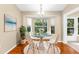Cozy dining area with a glass table, comfortable chairs, and ample natural light at 18736 Bent Pine Dr, Hudson, FL 34667
