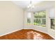 Bright dining room with bay windows offering a lovely view of the outdoors at 18736 Bent Pine Dr, Hudson, FL 34667