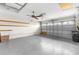 Spacious garage with ample room for parking and storage, plus a convenient ceiling fan at 18736 Bent Pine Dr, Hudson, FL 34667
