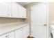Well-organized laundry room with ample storage space and a clean, efficient layout at 18736 Bent Pine Dr, Hudson, FL 34667