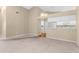 Open living space adjoining kitchen features white appliances and eat-in bar at 18736 Bent Pine Dr, Hudson, FL 34667